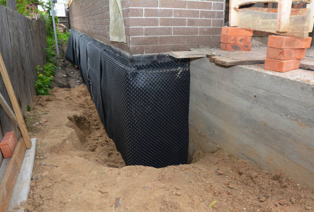 Happy homeowners after waterproofing job in Stirling